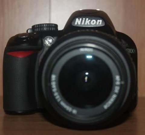 DSLR Nikon D3100 with lens and accessories photo